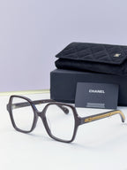 Eyeglasses with dark frame, clear lenses, gold chain temple, with case