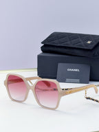 Eyeglasses with light beige frame, pink lenses, gold chain temple, with case