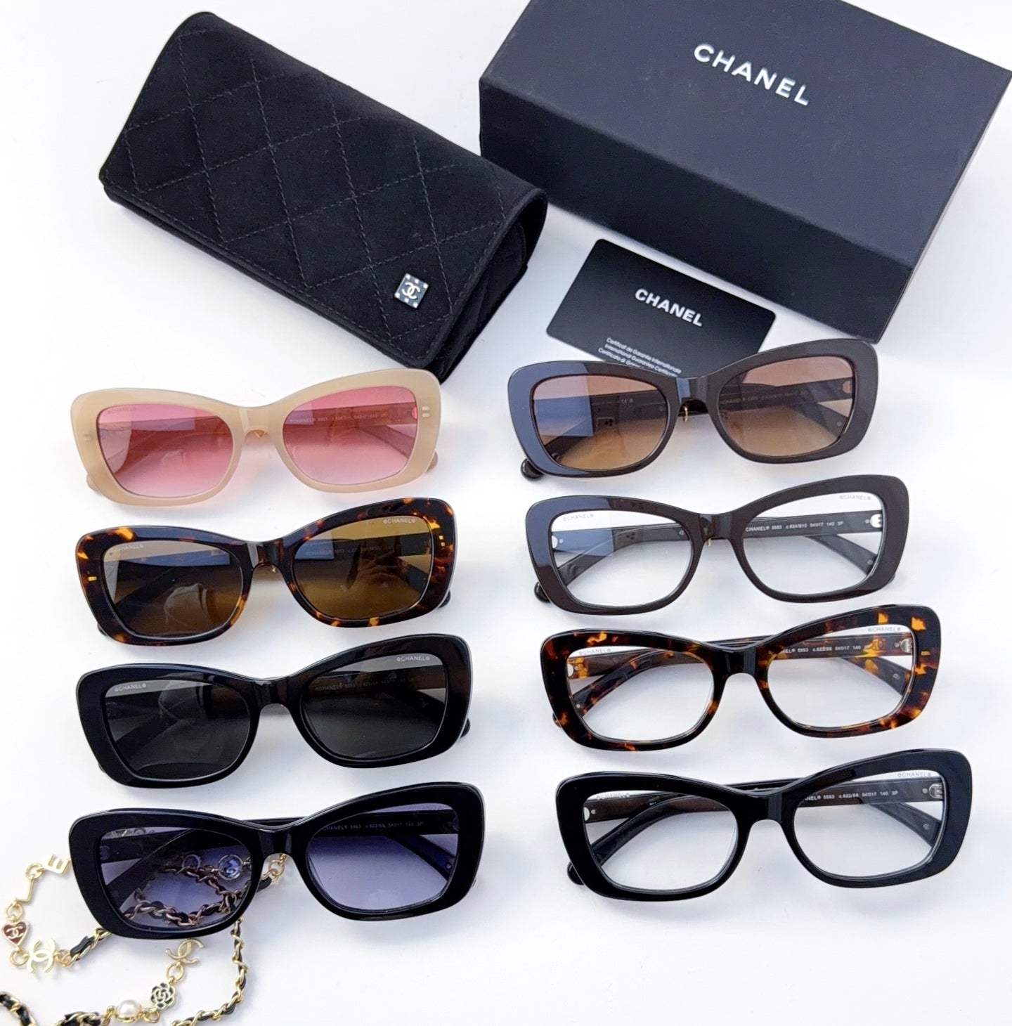 Assorted sunglasses with mixed frame colors and lens tints, shown together