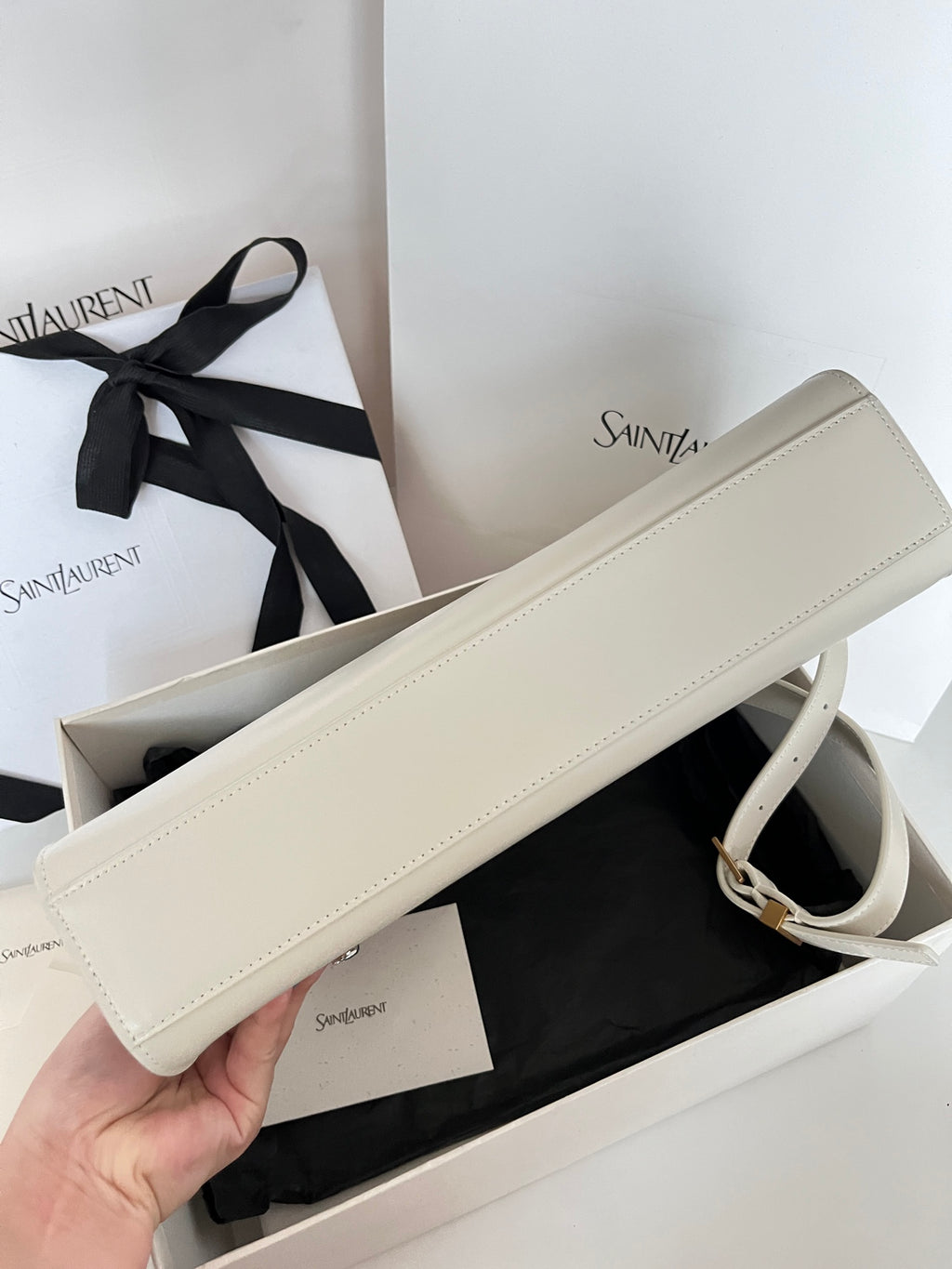 Ivory leather long shoulder bag with crossbody strap and gold buckle hardware