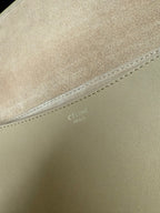 Celine bag close-up of tan leather with stitched seam detail