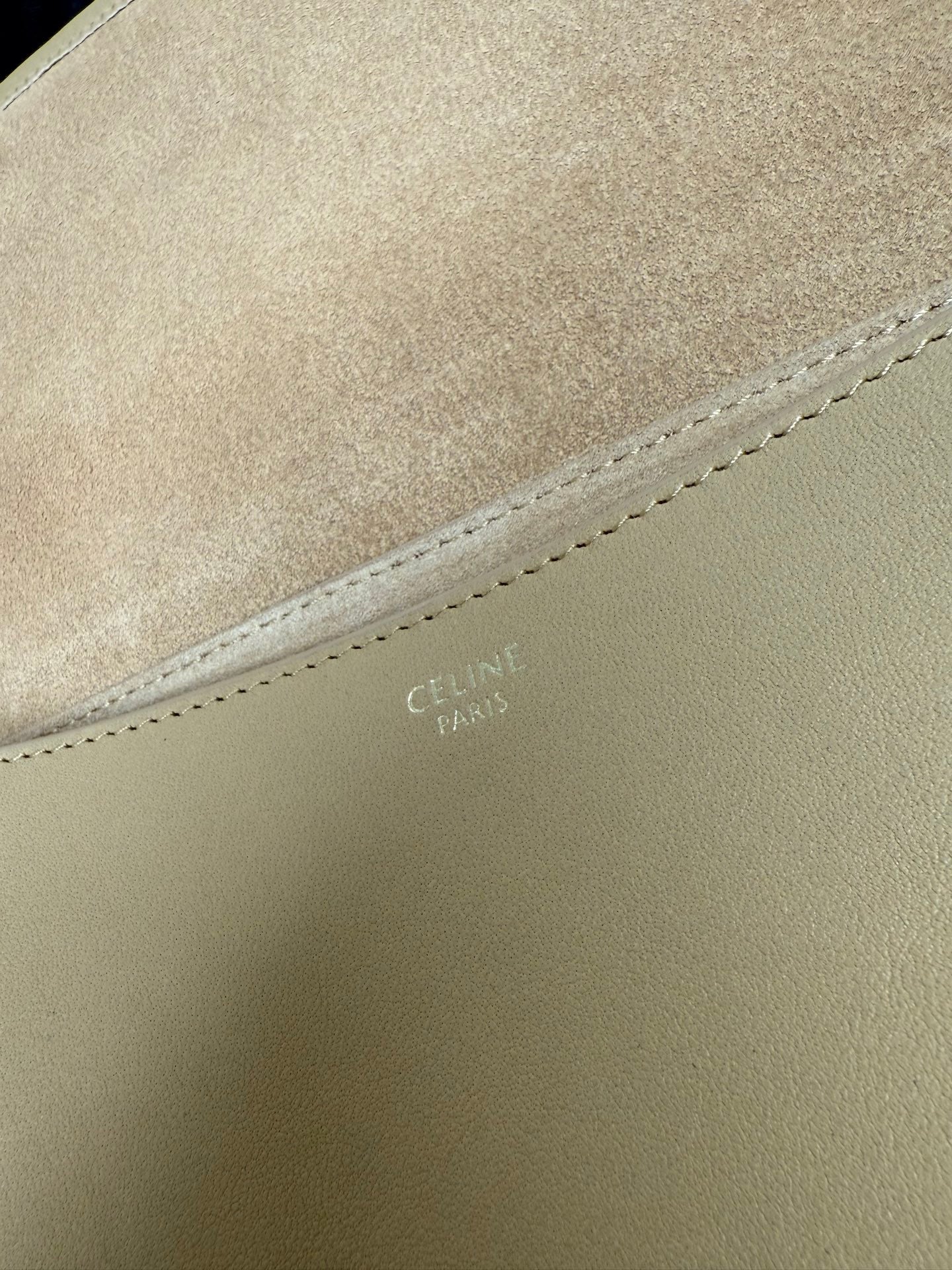 Celine bag close-up of tan leather with stitched seam detail