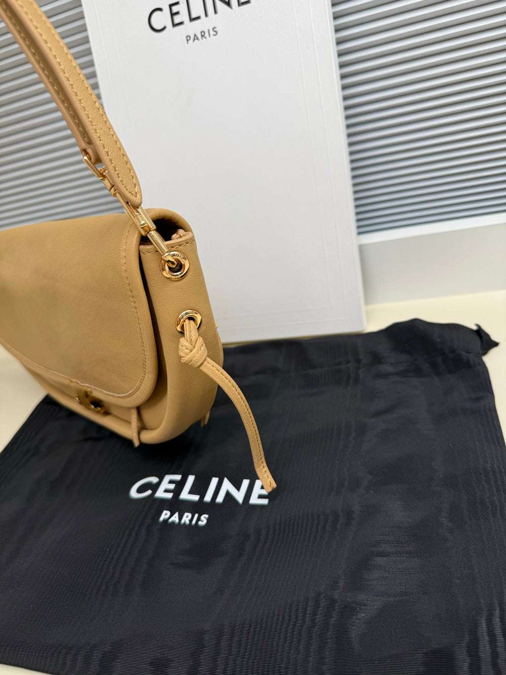Celine mini bag in tan with shoulder strap and clasp detail