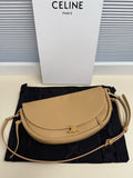 Celine crossbody bag in tan with curved flap and gold-tone clasp, adjustable strap