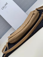Celine crossbody bag side view in tan with long strap and gold-tone hardware