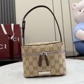 Gucci bag in beige-brown GG canvas with dark leather trim, top handle, zip front pocket