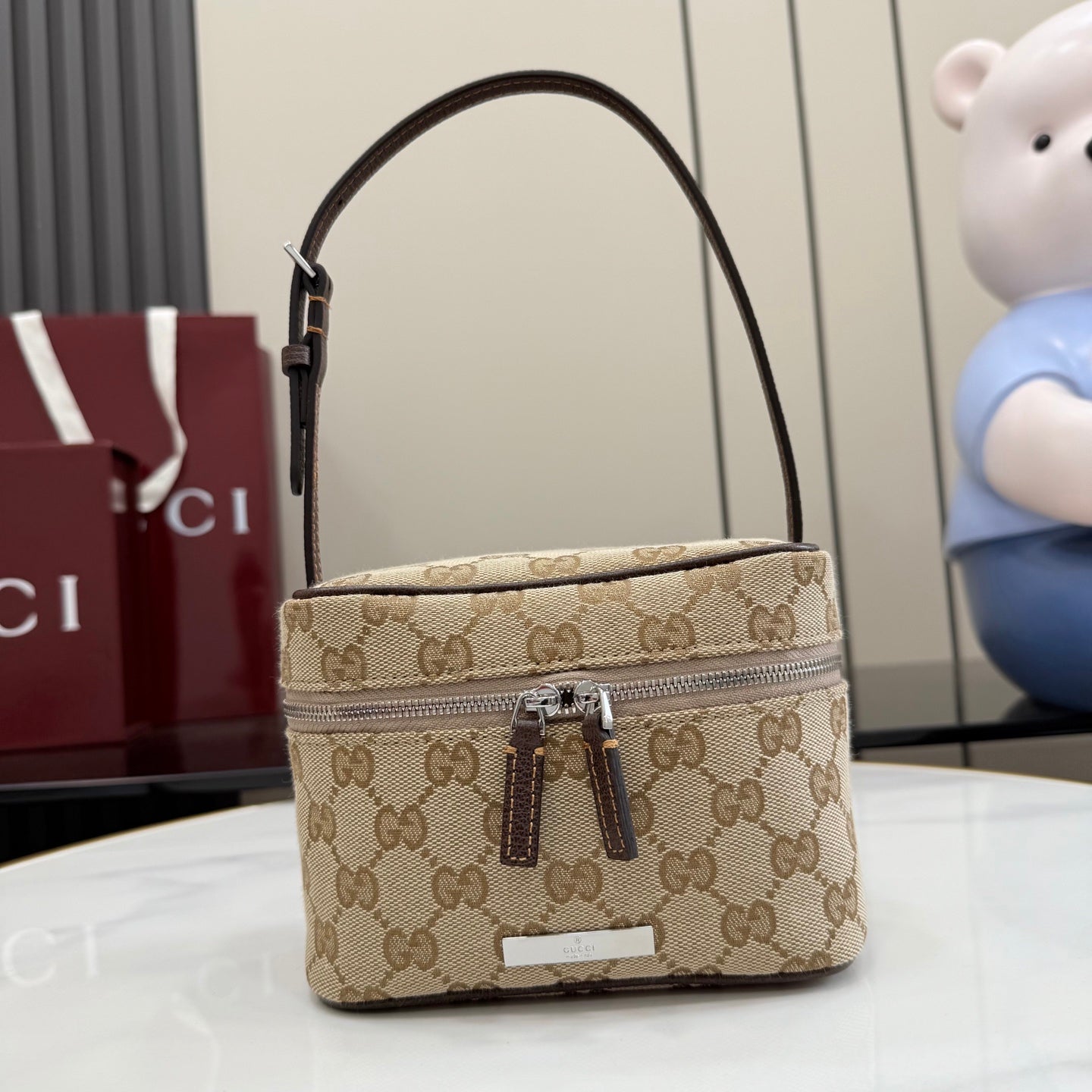 Gucci bag in beige-brown GG canvas with dark leather trim, top handle, zip front pocket