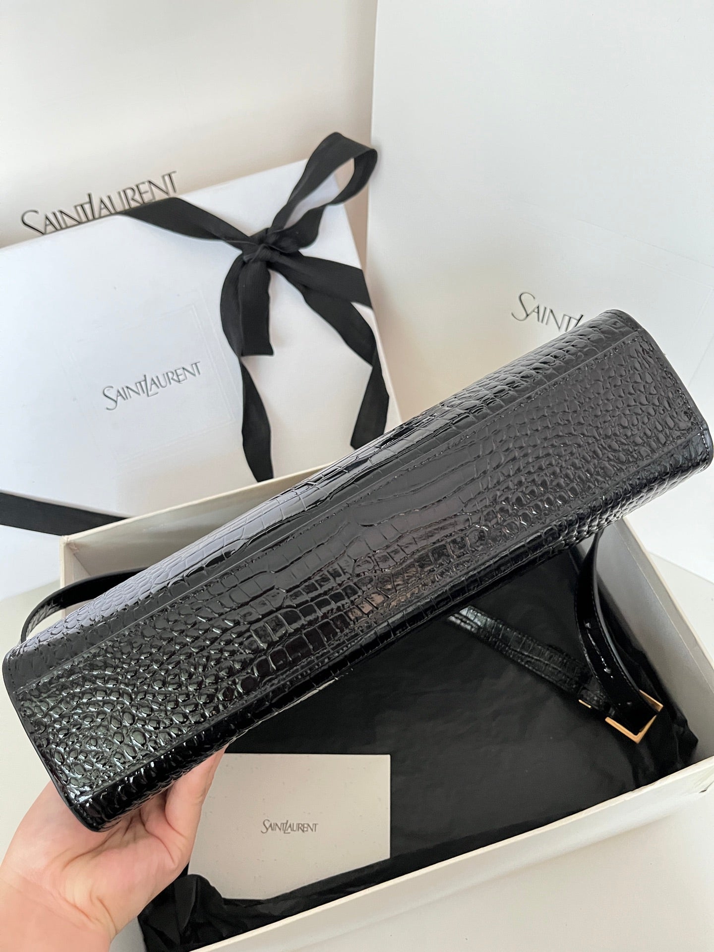 YSL black croc-texture handbag with gold-tone buckle and long strap