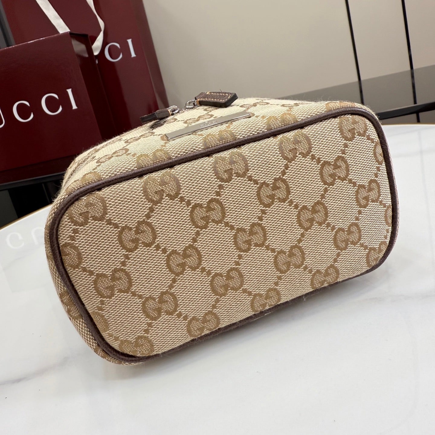 Handbag with beige GG canvas, dark piping and leather, top handle, side zip closure