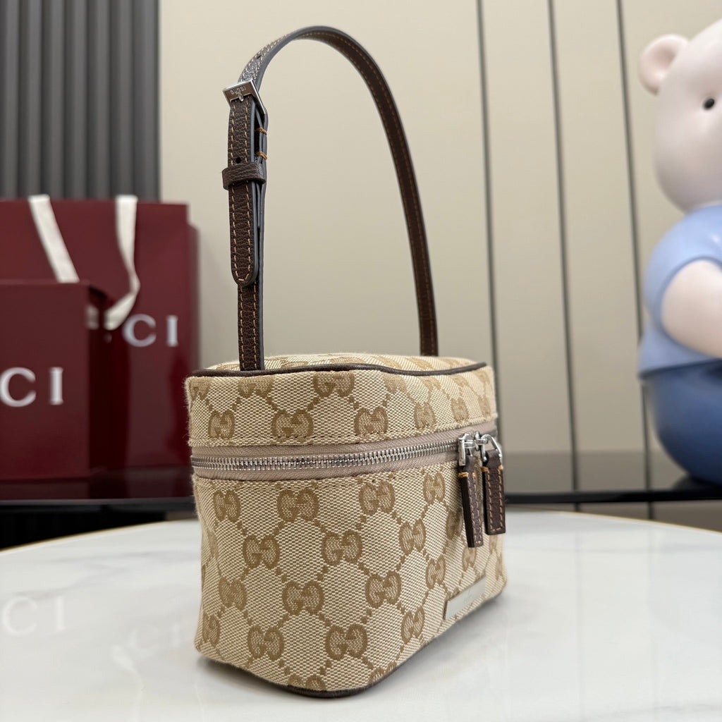 Handbag with beige GG canvas, dark leather trim, top handle and side zip pull