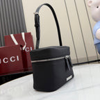 Black pebbled leather mini shoulder bag with silver-tone zipper and strap