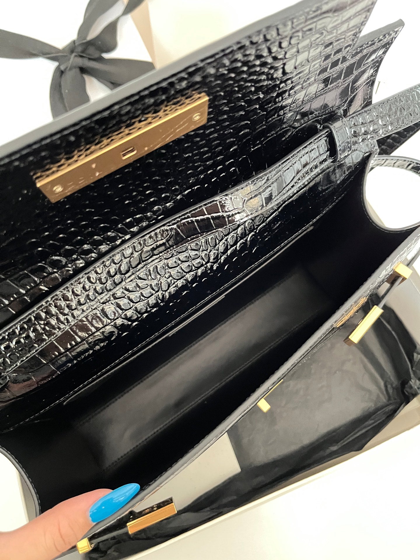 YSL black croc-texture bag interior with gold-tone hinge and trim