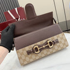 Gucci bag front view with dark leather top and flap, GG canvas band, gold closure
