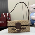 Gucci bag with GG canvas and dark leather trim, top handle, gold clasp hardware