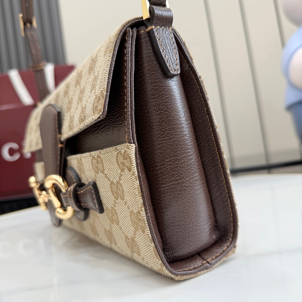Gucci tote bag with beige monogram canvas, dark brown leather trim, top handles