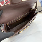 Gucci bag interior view with zip opening, dark leather lining and gold-tone hardware