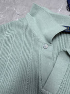 Light blue knit polo shirt neckline with two-button placket