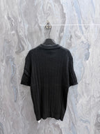 Ralph Lauren knit polo shirt back view in dark charcoal with ribbed collar and hem