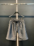 Dior patterned pants with elastic waistband and all-over blue monogram print