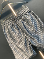 Dior patterned pants with elastic waistband and blue-gray monogram print