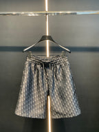 Dior patterned pants with elastic waist, wide legs, and blue-gray monogram print