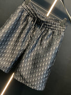 Dior patterned pants, angled view, gathered elastic waist and monogram print