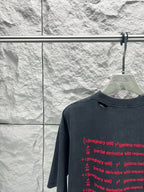 Balenciaga dark blue crew-neck T-shirt close-up with red formula text, short sleeves