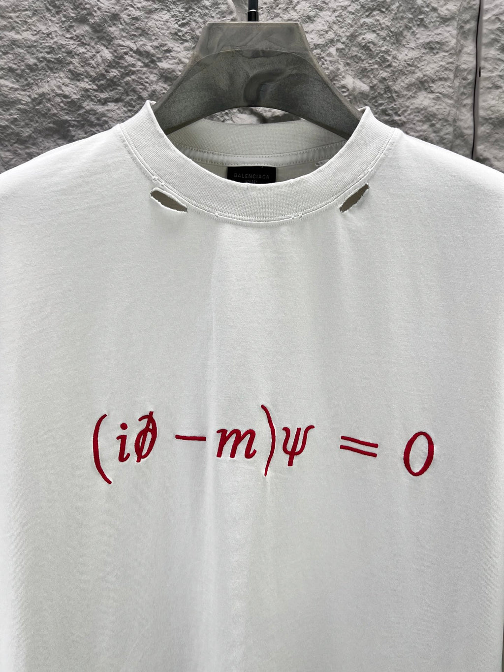 White short-sleeve T-shirt with crew neck and red graphic print detail