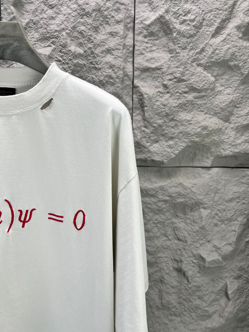 White short-sleeve T-shirt with red graphic print on the chest