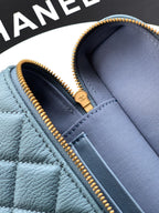 Chanel bag close-up: light blue interior with zip edge and logo tab