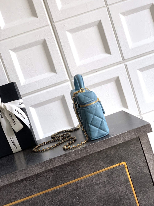 Chanel quilted mini handbag in light blue with chain strap and top handle