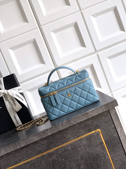 Chanel quilted handbag in light blue with top handle and gold-tone chain strap