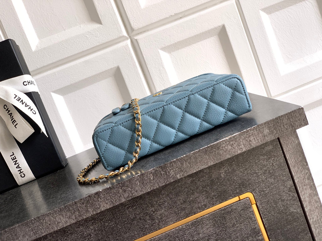 Chanel quilted shoulder bag in light blue with chain strap and top handle