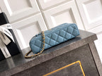 Chanel quilted shoulder bag in light blue with chain strap and top handle
