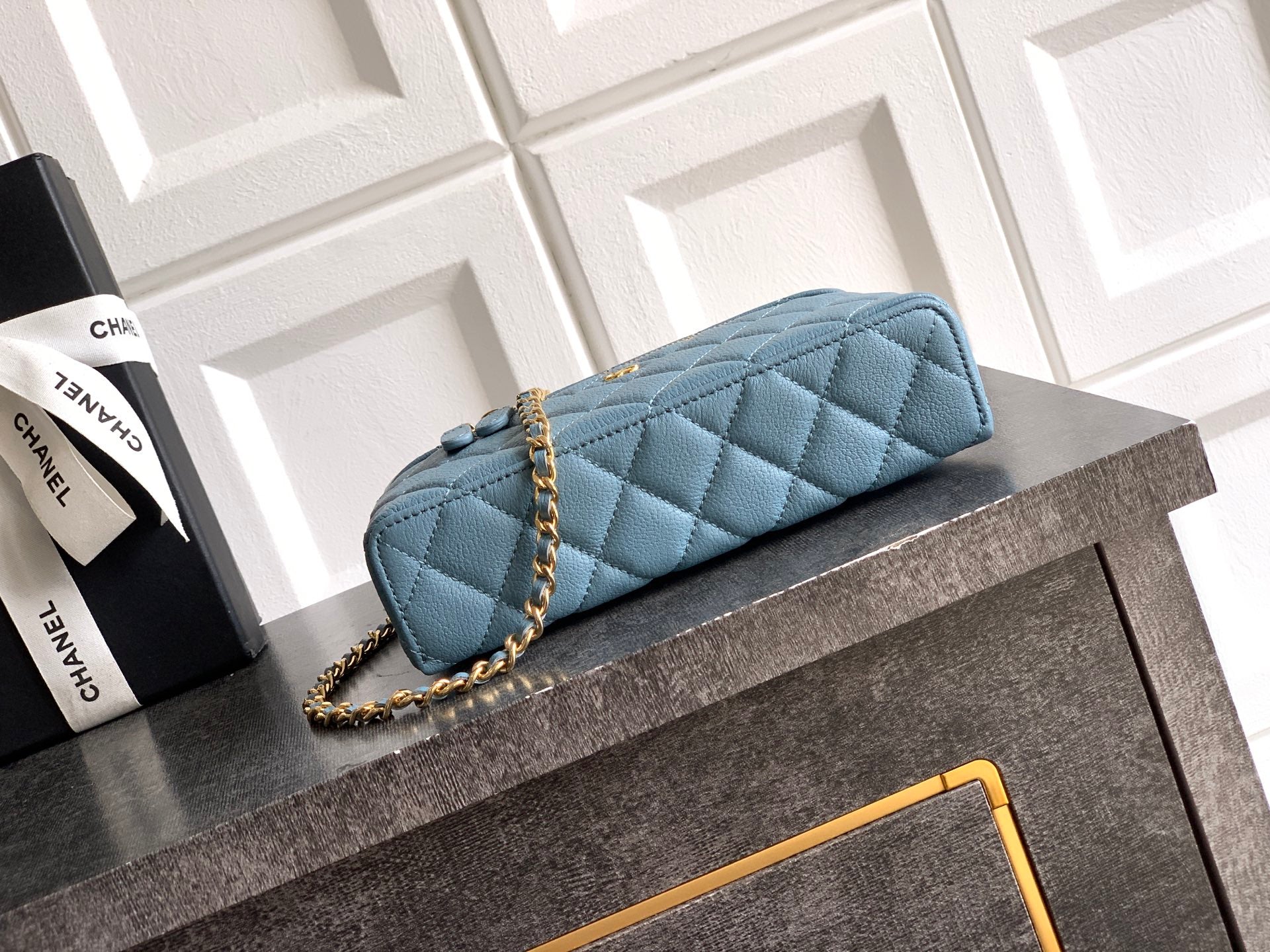 Chanel quilted shoulder bag in light blue with chain strap and top handle