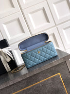 Chanel quilted handbag in light blue with open flap and interior lining