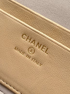 Beige leather bag label with CHANEL text and Made in Italy