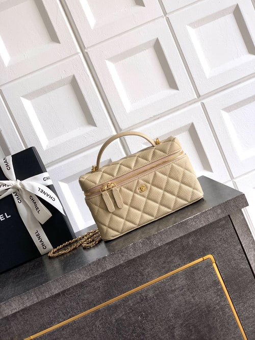 Chanel quilted handbag in light beige with top handle and gold chain strap