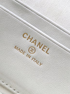 Close-up of white leather bag stamp: CHANEL MADE IN ITALY