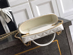 White quilted mini bag with open top and gold zipper, beige interior