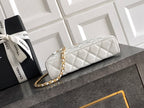 White quilted handbag with gold zipper and gold chain strap