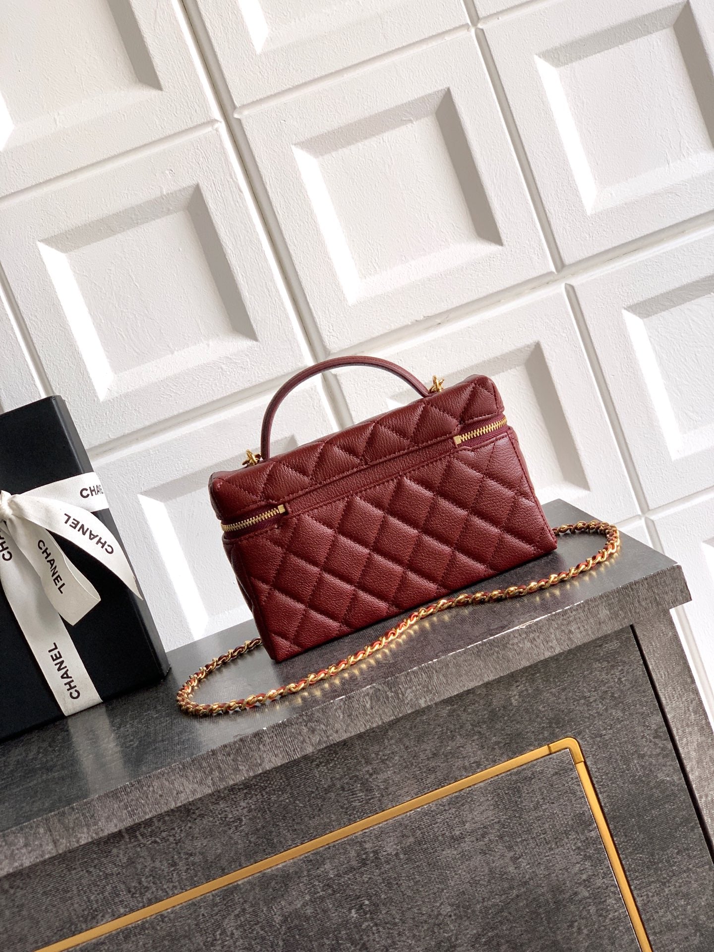 Chanel quilted top-handle handbag in burgundy leather with gold chain strap