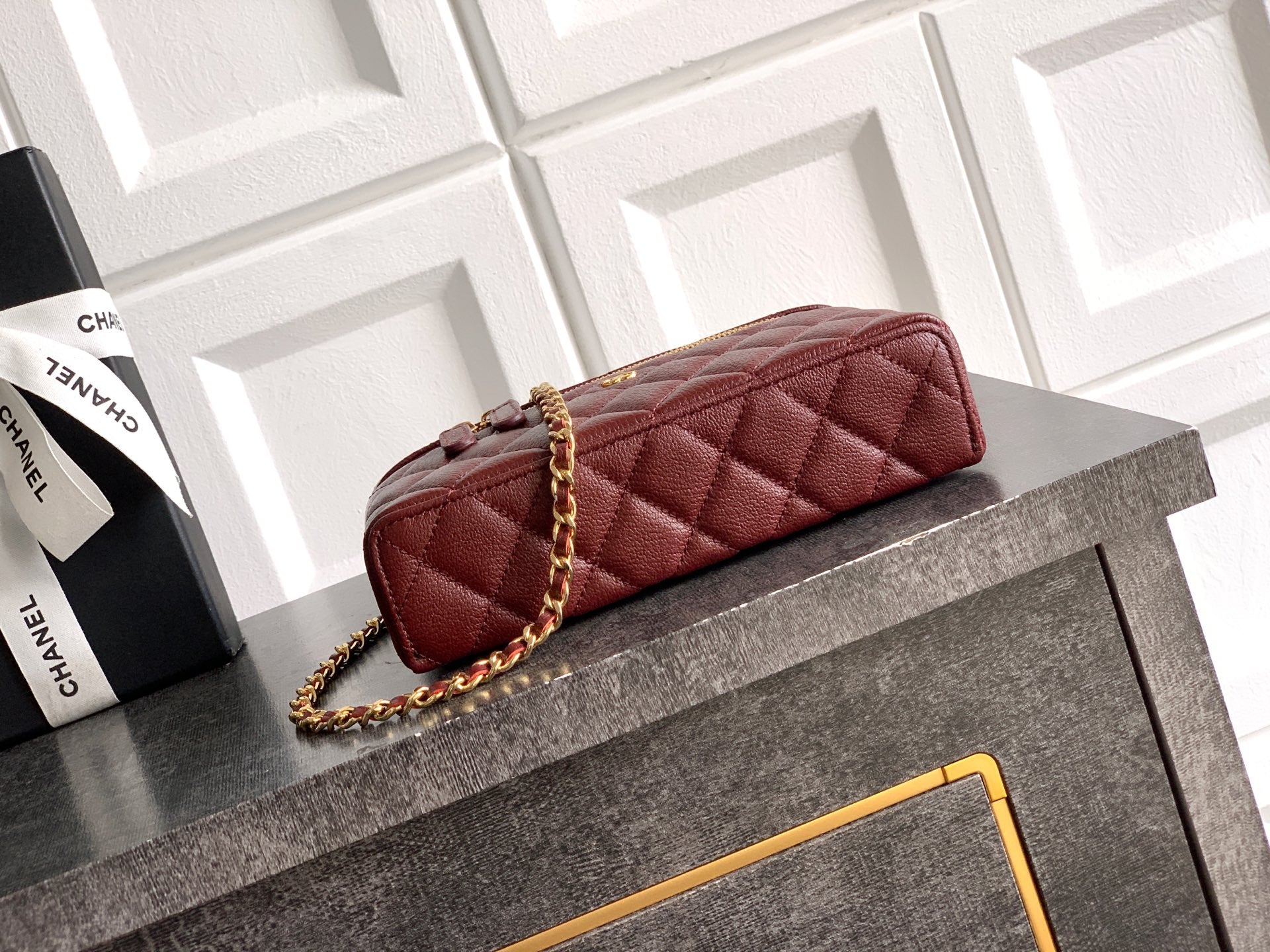 Chanel quilted top-handle bag in burgundy leather with gold chain and zipper