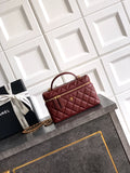 Chanel quilted top-handle handbag in burgundy leather with gold chain strap