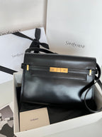 YSL handbag in dark leather with gold-tone front hardware and top handle