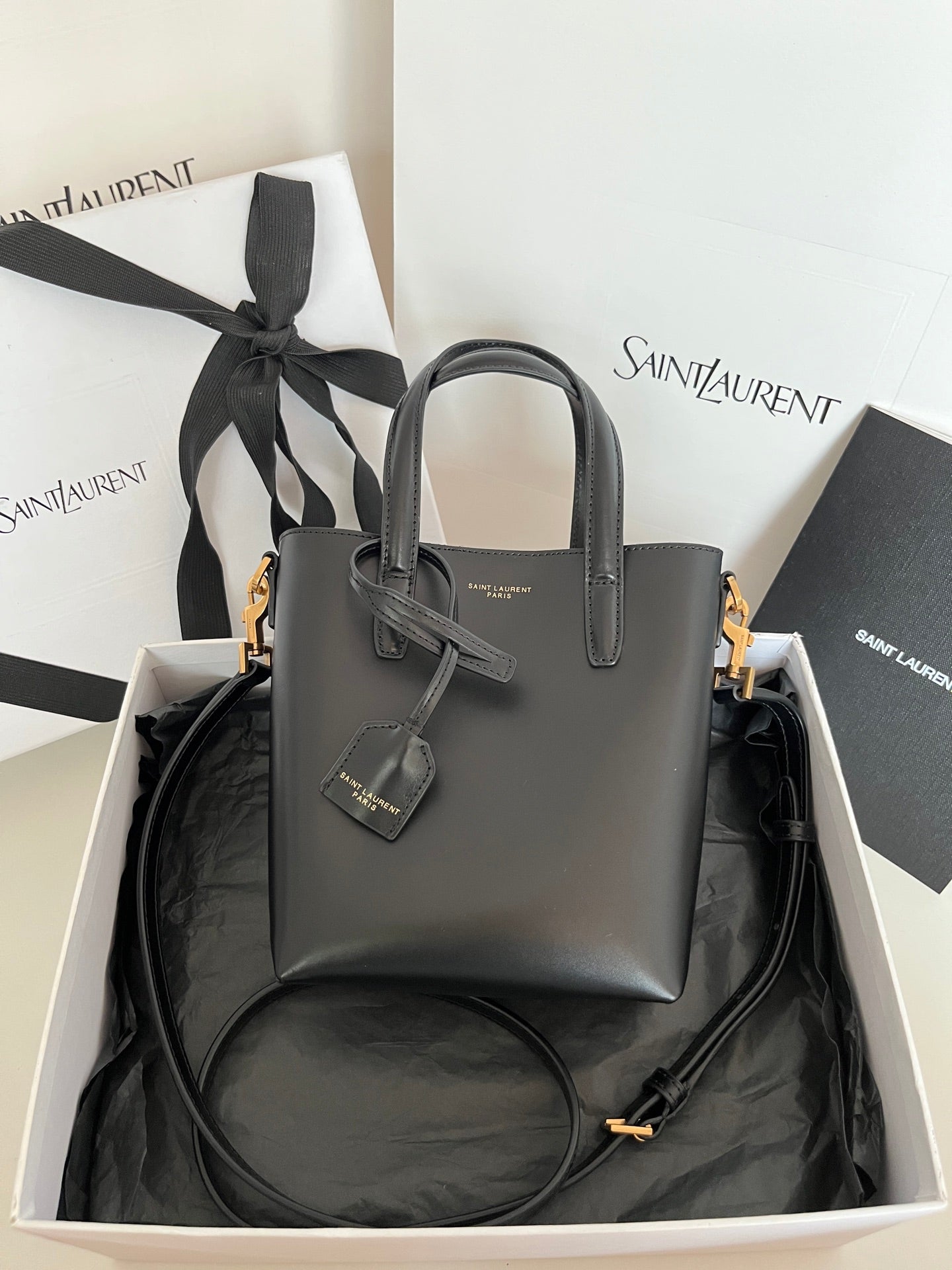 YSL dark gray leather tote bag with bow charm and gold-tone hardware