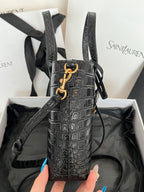 Black croc-embossed leather tote bag with front YSL clasp and crossbody strap
