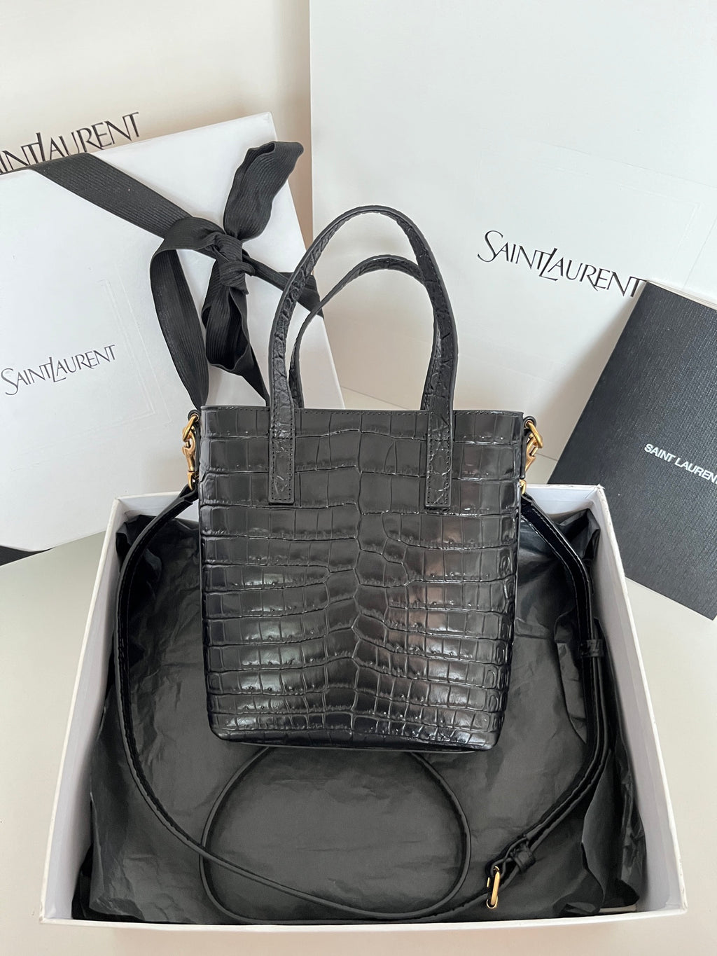 Black croc-embossed leather tote bag with detachable strap and gold hardware