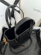 Black croc-embossed leather tote bag interior view with top handles and gold hardware