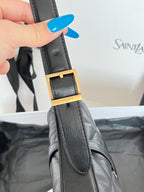 Leather bag strap with rectangular gold buckle and stitching detail